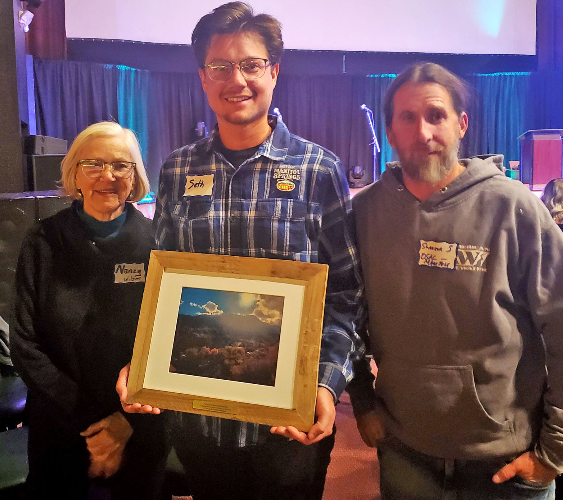 Courtesy photo. From left, Nancy O. Wilson of OSAC, Seth Tyler, Manitou parks manager, and Shannon Solomon, OSAC chair, with the award.