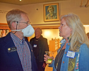 Photo by Rhonda Van Pelt. Political activist Annie Schmitt talks with Pete Lee.