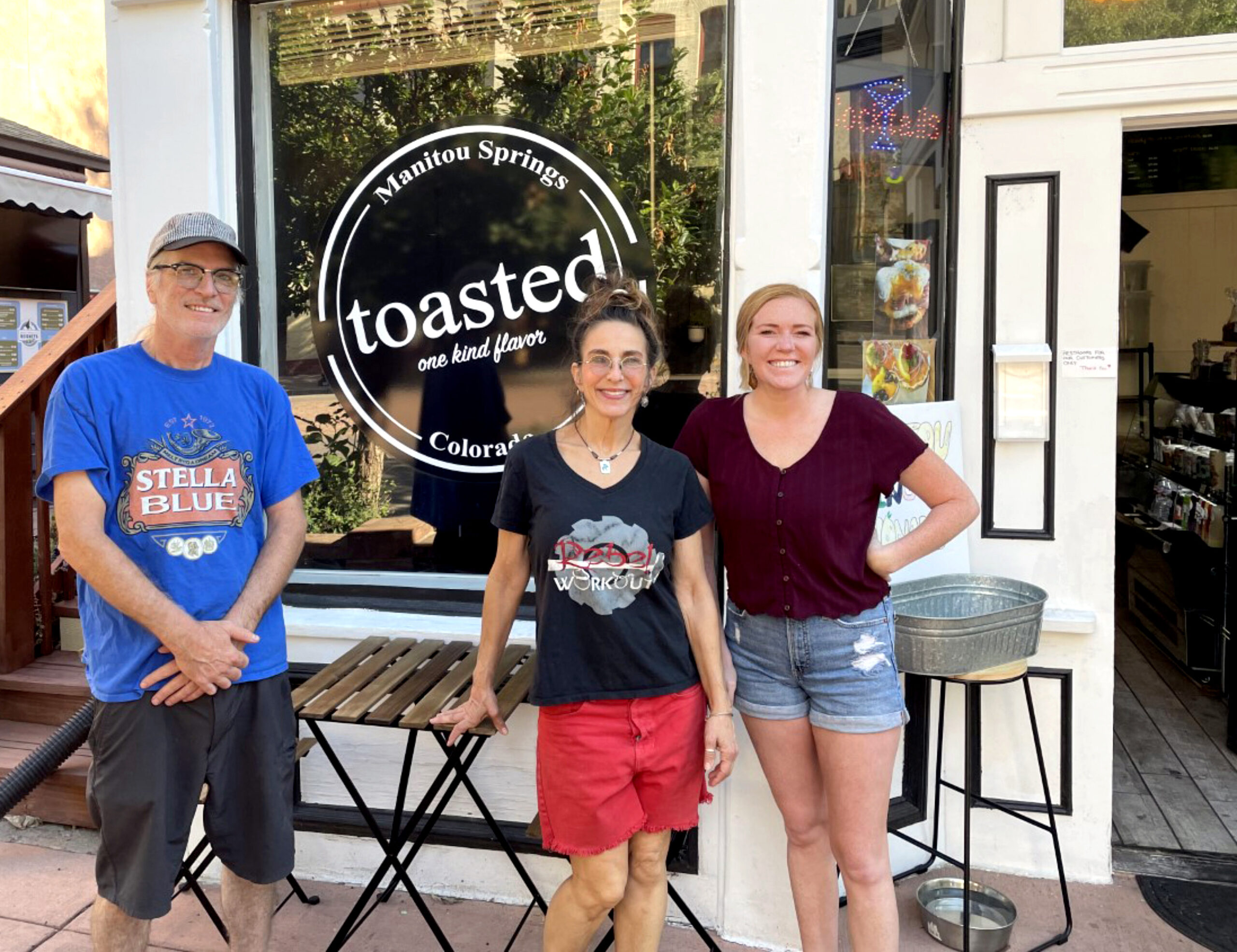 Photo by Cailéan Anderson. Jamie and Alisa Young stand with Jordan Johnson, right, outside the restaurant.